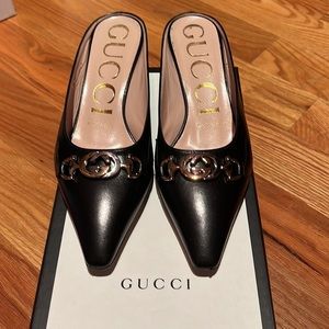 Gucci black leather kitten heels with gold and silver metal detail. Size 36/6.